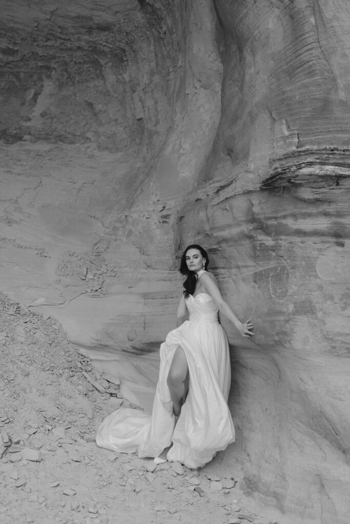 Bride dress in a luxurious silk dress on her elopement day at Amangiri.