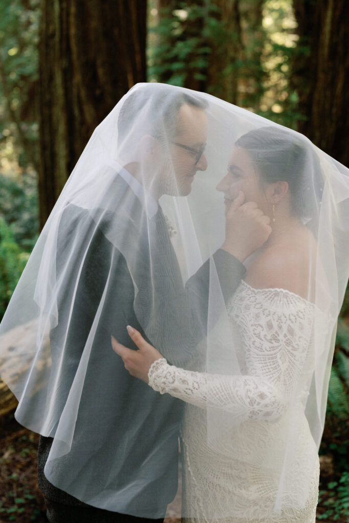 Wedding portraits underneath veil. 