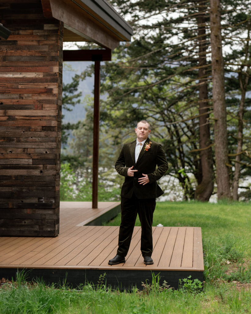 portrait of groom standing outside oregon micro wedding venue