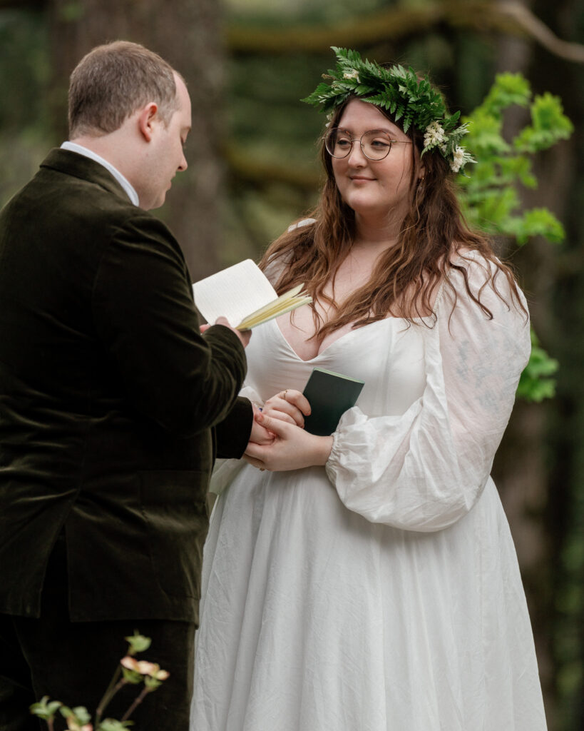 bride's reaction to groom reading vows during their micro wedding ceremony