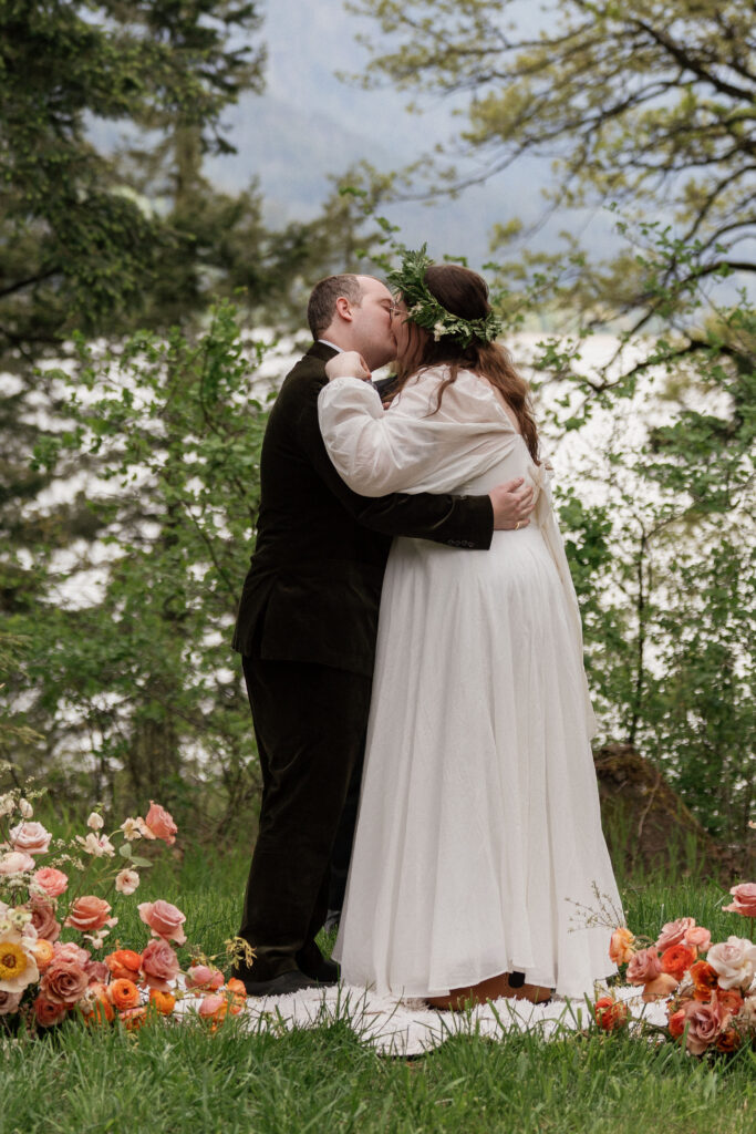 bride and groom first kiss at their micro wedding