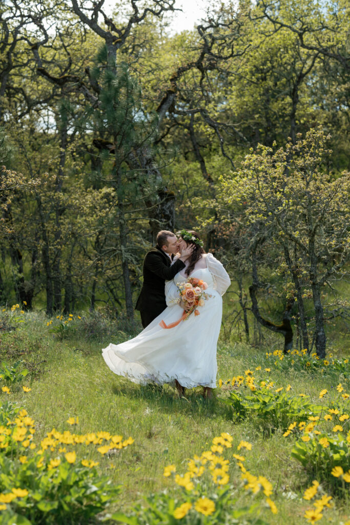 groom and bride at their Rowena Crest wedding in Oregon in a wildflower meadow