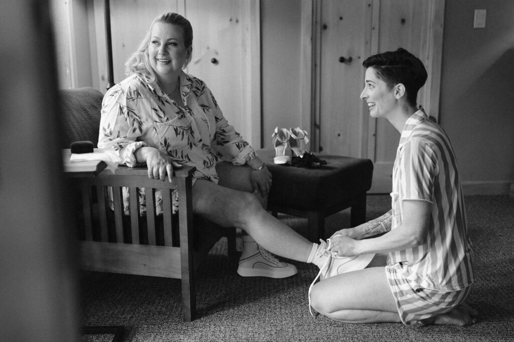 brides putting on wedding shoes