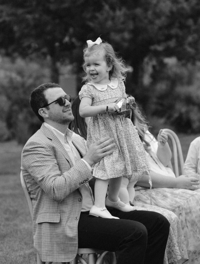 Flower girl celebrating at wedding ceremony