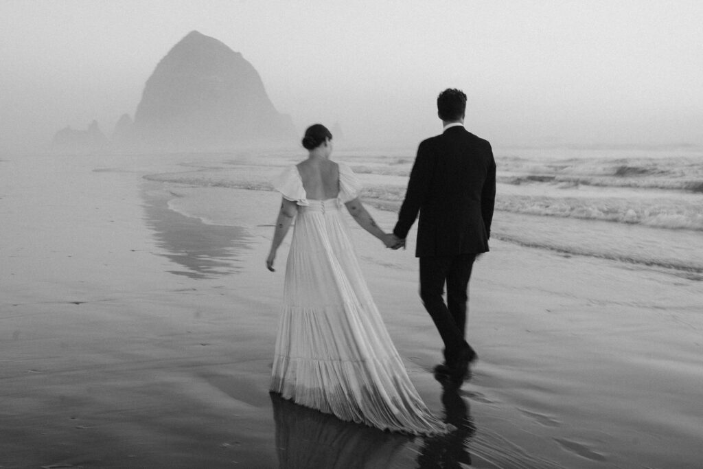 Black and white wedding photo on Cannon Beach in Oregon