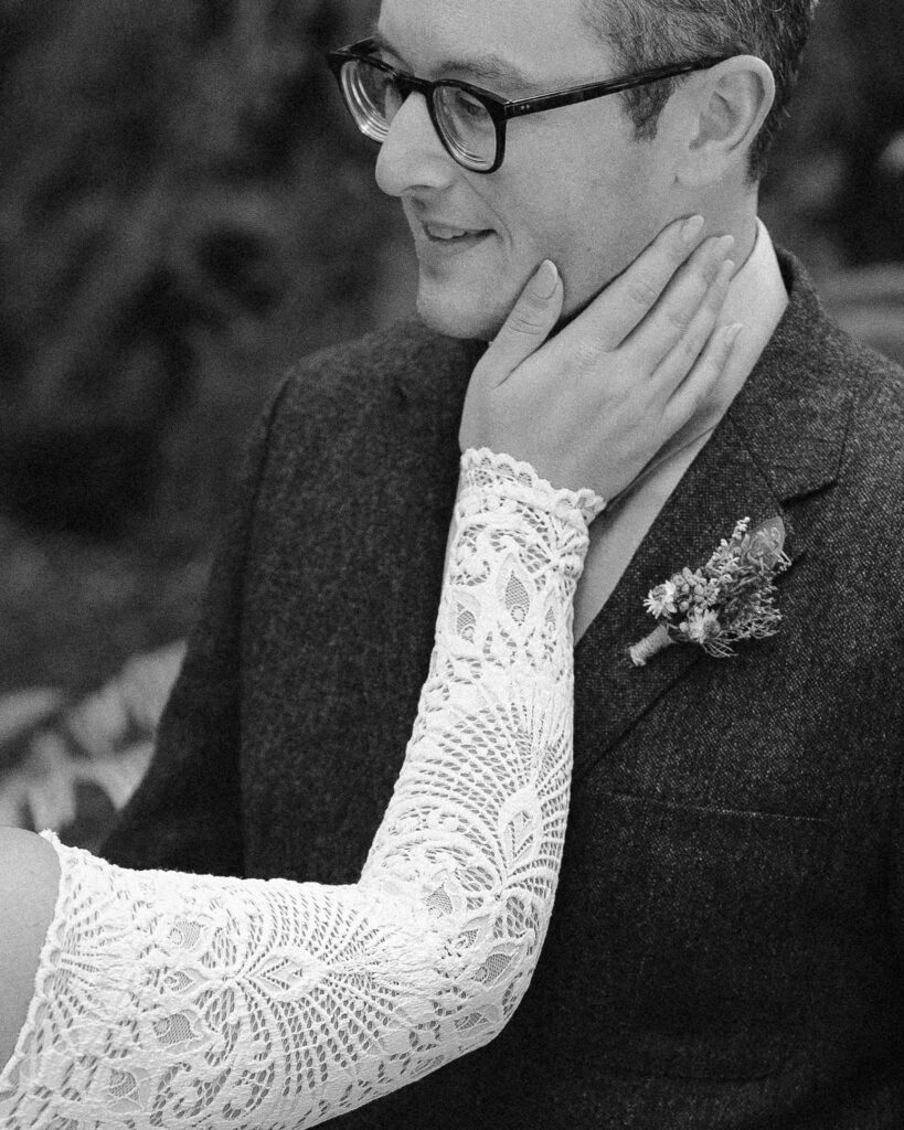 poetic elopement photo of bride touching groom's cheek